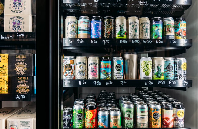 Close up of different beers in the beer fridge.