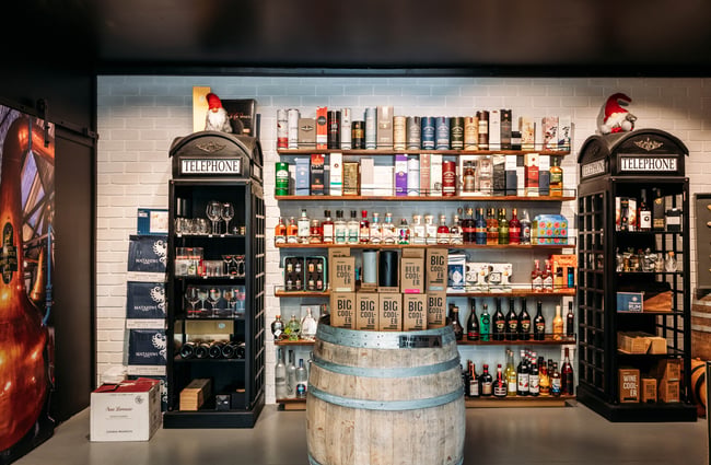 Bottles of spirits on shelves against the wall at Wine Craft.