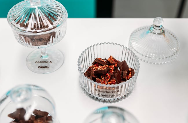 Glass dishes with chocolates in them at Wonderland Chocolate.