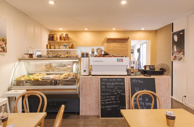 Food cabinet and coffee machine at Woods Cafe.