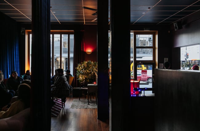 People inside the dark bar.