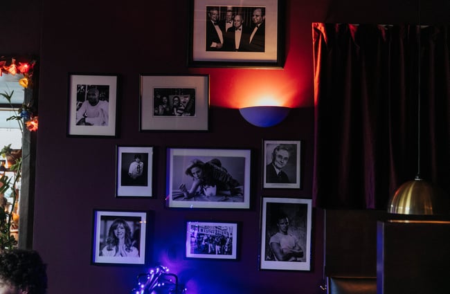Black and white photos on a wall.