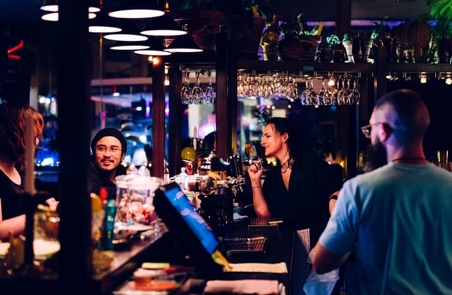 People hanging around the bar.
