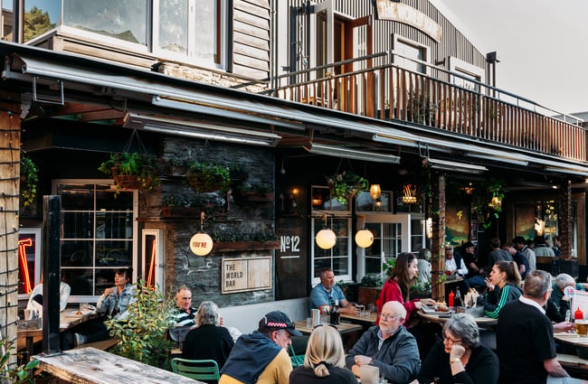 People dining in a courtyard.