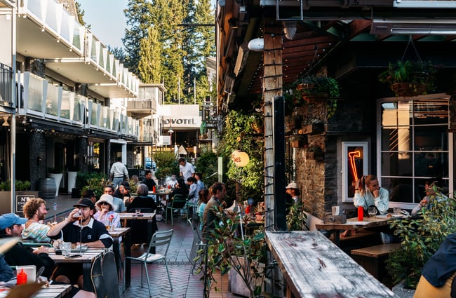Customers dining outside in a pretty courtyard.