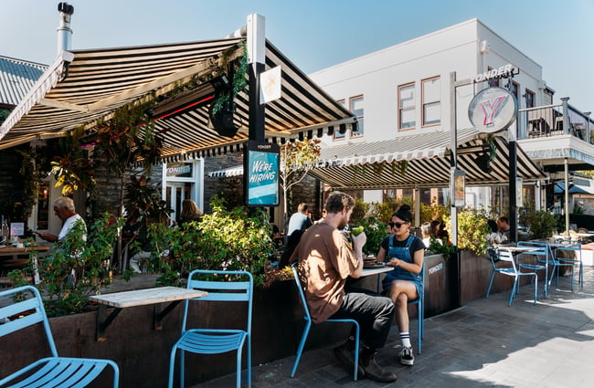 Customers dining on a footpath outside Yonder Queenstown.