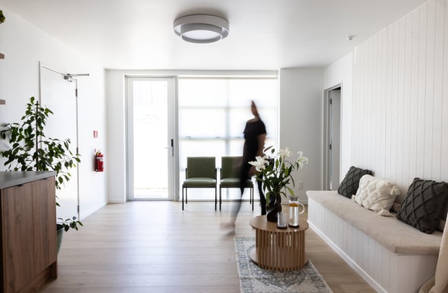A customer walking through the reception area at yourSPAce.