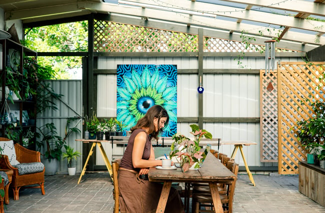 Customer working on their laptop at Hub Matakana.