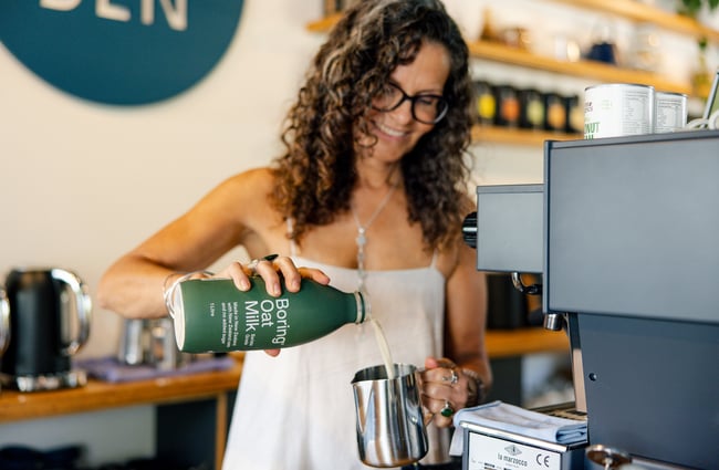 Barista making a coffee at Hub Matakana.