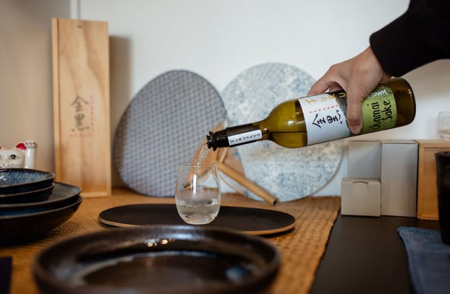 Sake being poured into a glass at  Zenkuro in Queenstown