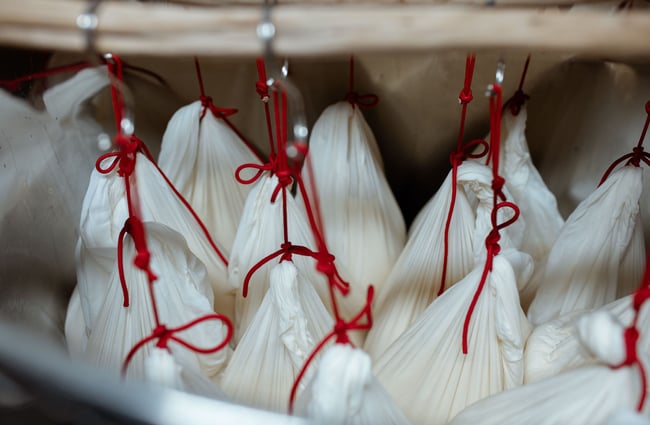 Sake being brewed in bags with red ties at  Zenkuro in Queenstown