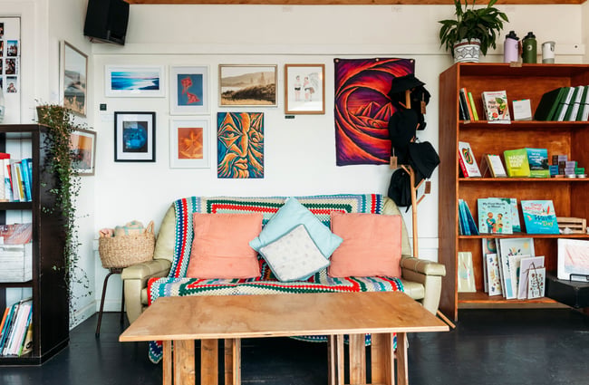 A vintage couch covered with antique throws.