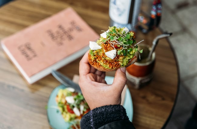 A close up of a a piece of loaded toast.