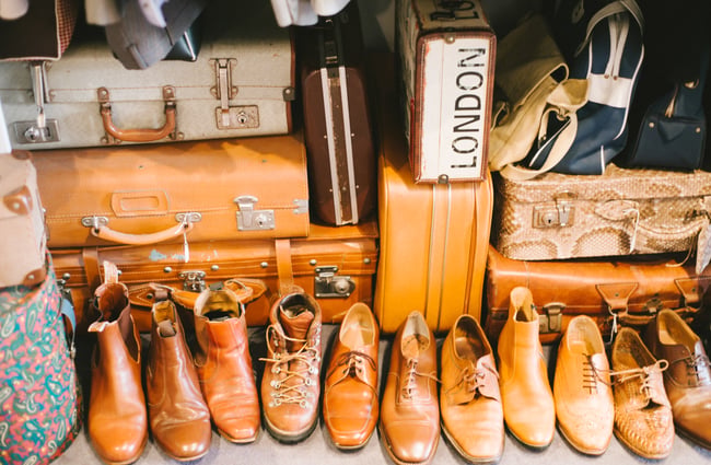 Close up of shoes and suitcases.