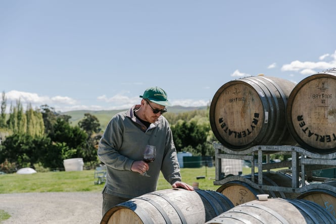 James Opie of Bryterlater Wines making wine outside.