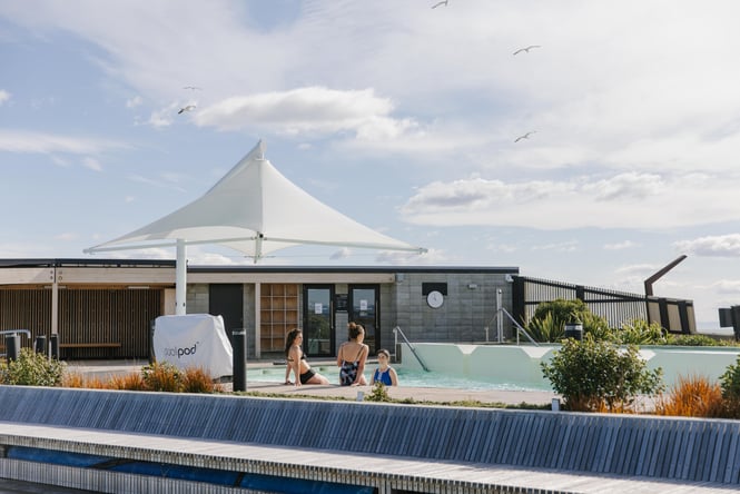 Three women in a hot pool at New Brighton hot pools.