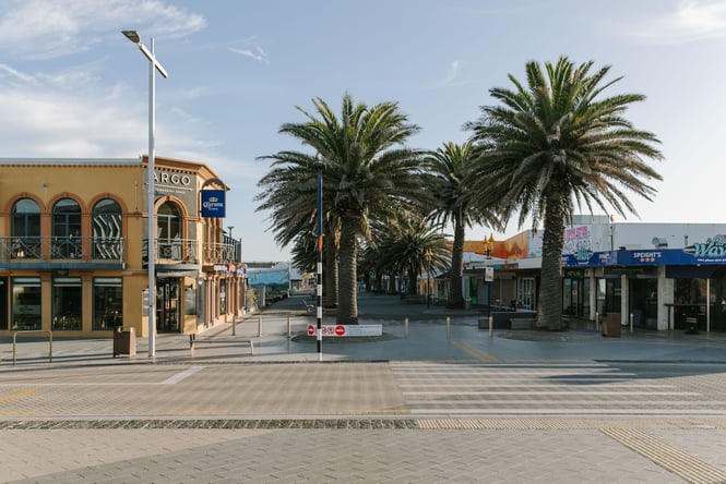 The streets of a beach side suburb on a sunny day.