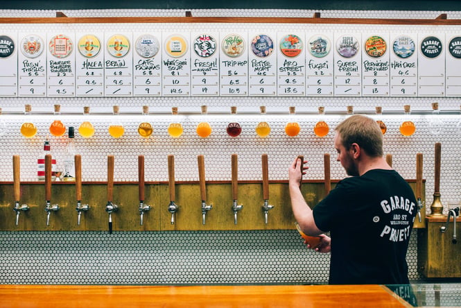 A man pouring beer.