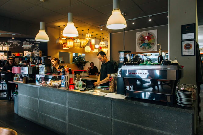 Staff standing behind the counter.