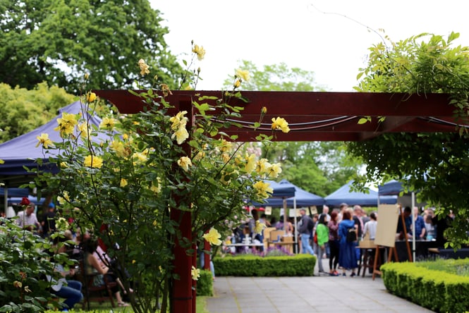 Flowers with the Christchurch Farmers Market in the background.