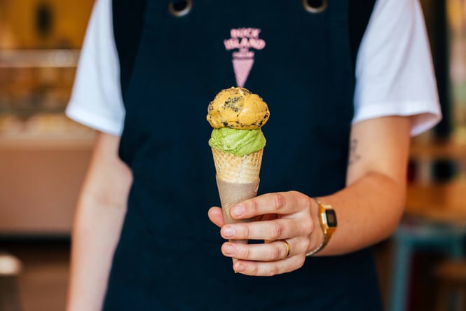 Someone holding an ice cream.
