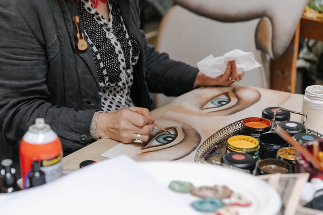 Close up of Donna Demente painting at Grainstone Gallery in Ōamaru.