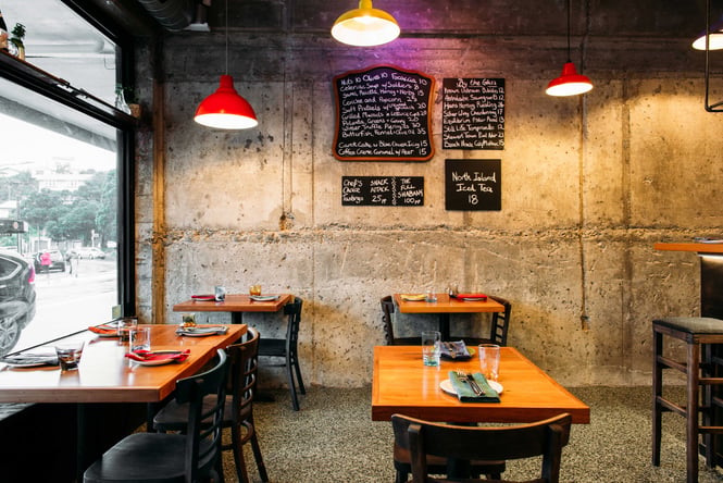 The small seating area inside the brightly lit Graze Wine Bar in Wellington.