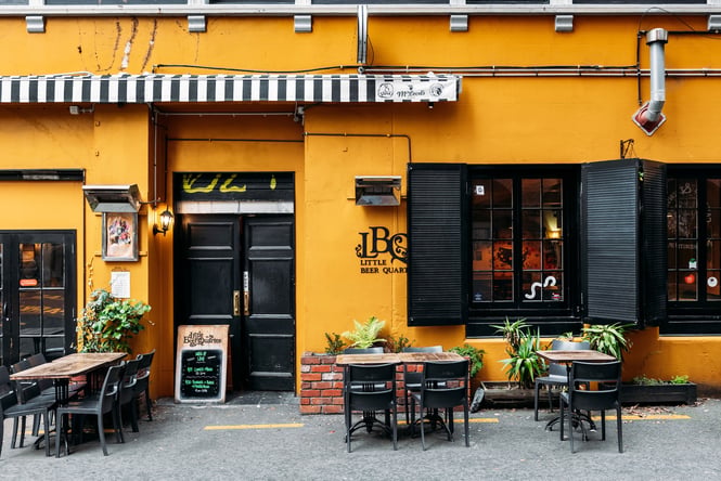 The yellow exterior of Little Beer Quarter.