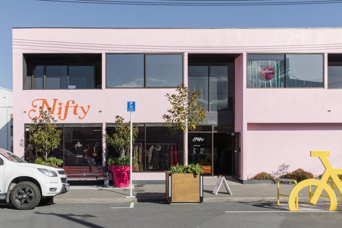 Bright pink building exterior of Nifty.