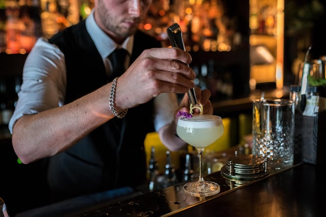 Bartender making drinks.