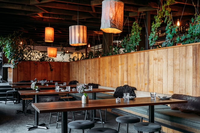 The wood and green interior of The Sherwood Queenstown.