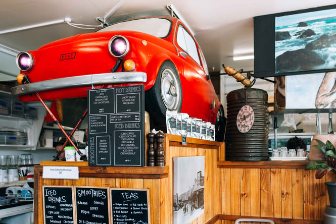 Red car in a cafe
