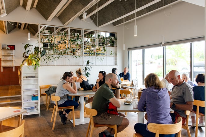 Customers sitting at tables in The Birdwood.