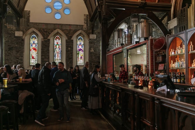 The busy bar inside The Church Pub.