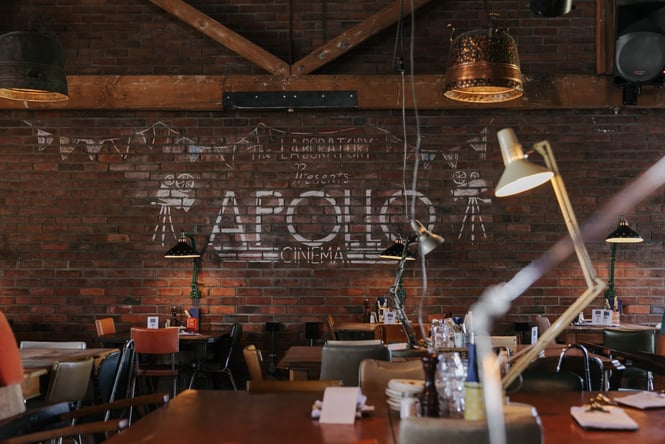 Seating area with exposed brick wall.