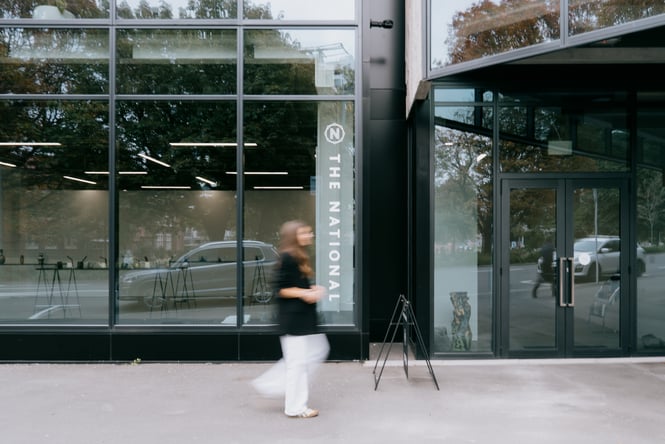 Person walking past exterior of The National gallery in Christchurch