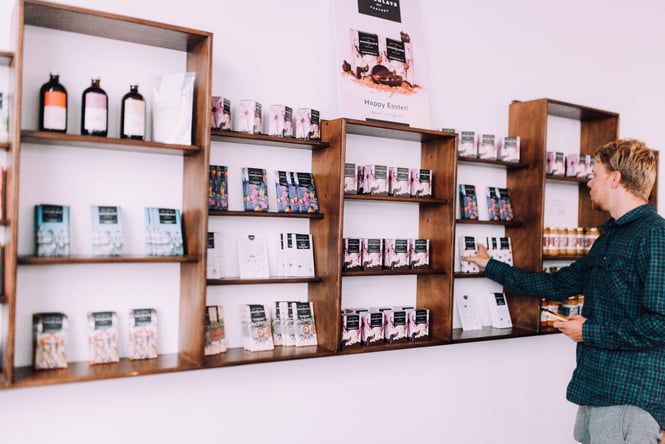 A man picking out chocolate.