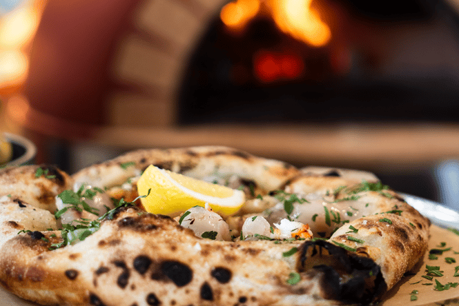 Close up of a pizza at Sumner Post Office.