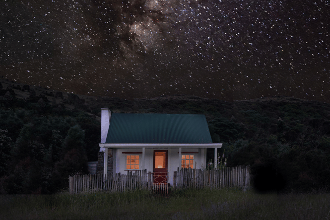 Christchurch accommodation with a green roof under the start night sky.
