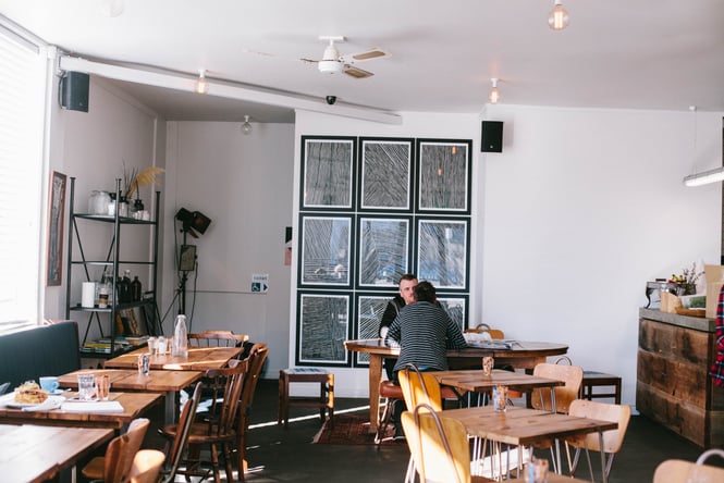People dining at a table at Gentle Giant.
