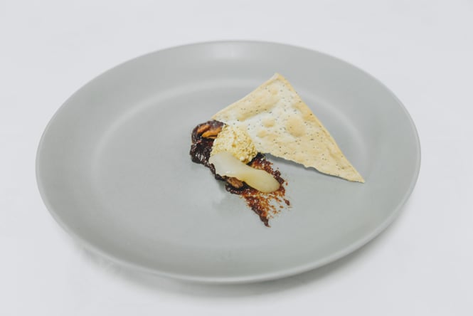 A close up of a plate of food on a white table.