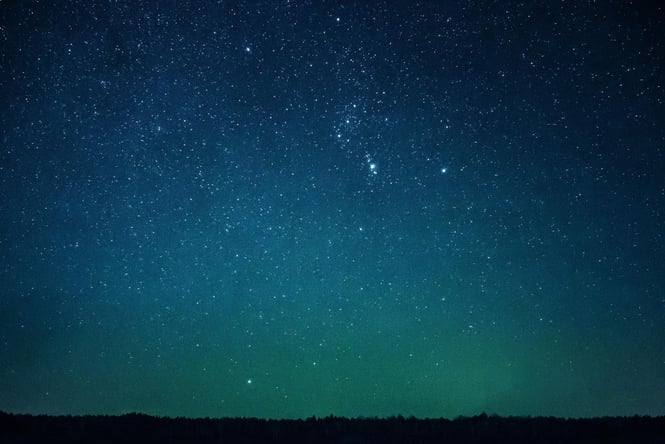 A dark blue starry sky.
