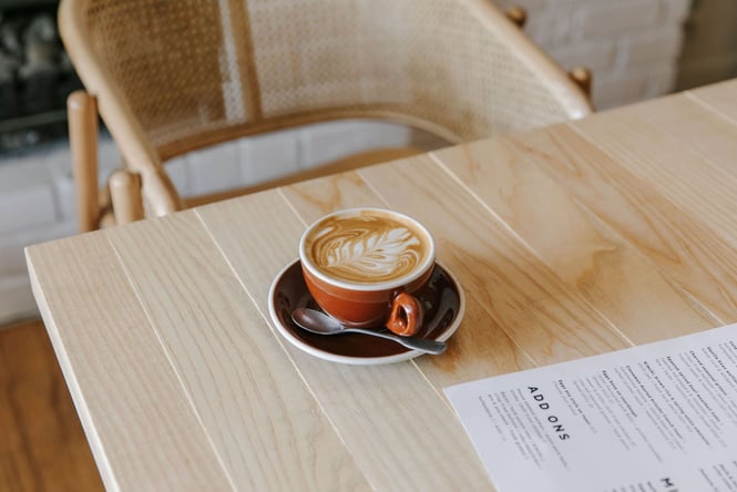 Cup of coffee on the table at Mint Folk & Co