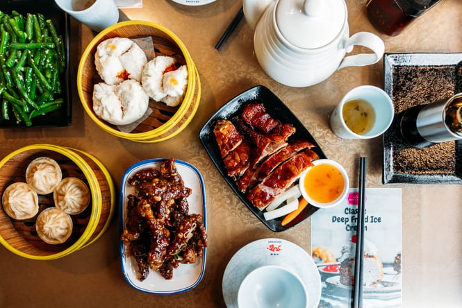 A flatlay of plates of food at Dragons Wellington.