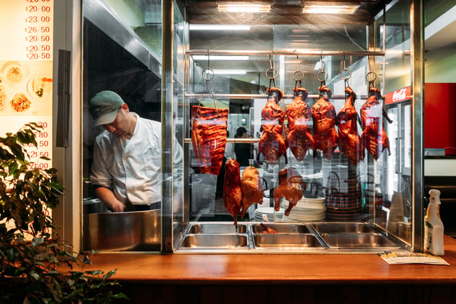 Cooked meat hanging up in KC Cafe.