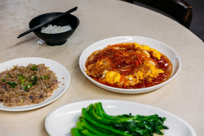 Plates of food on a table at Magic Kitchen Wellington.