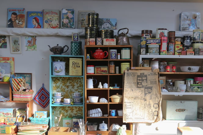 Shelf full of eclectic vintage homewares and secondhand treasures at Seaside Vintage in New Brighton