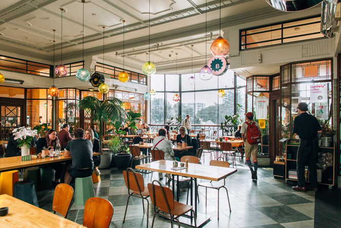Interior of Bestie in St Kevin's Arcade in Auckland with great views of the city through stained glass windows