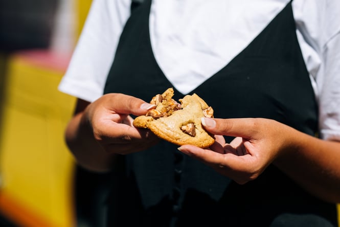 Cookie being pulled apart by a customer.