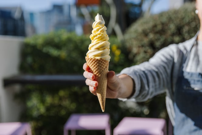 Customer holding an ice cream.